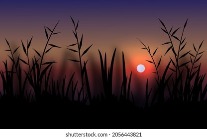 Beautiful sunset landscape with silhouette of grass
