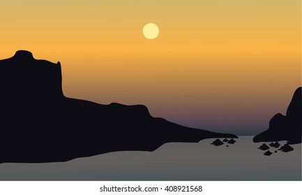 beautiful sunset on the beach with rocks at tthe afternoon