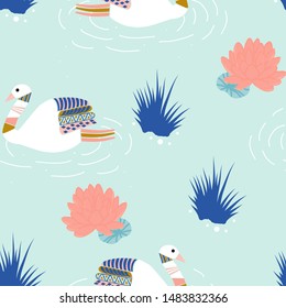 Beautiful swans on a lake, in a seamless pattern design, perfect to use on the web, or in print, for surface design