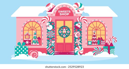 Beautiful sweet shop in Christmas festive decor with garlands, lights, creative decorations. Showcase of confectionery shop with Christmas sweet souvenirs. Xmas house exterior decoration