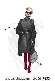 Beautiful, tall and slender girl in a stylish coat, dress, and glasses. Stylish woman in high-heeled shoes. Fashion & Style. Vector illustration.
