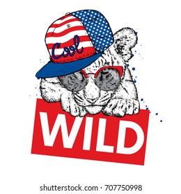 A beautiful tiger cub with glasses and a cap. Vector illustration for a postcard or a poster, print for clothes and accessories. Wild tiger. Fashion & Style. American flag. The Patriot of the USA.