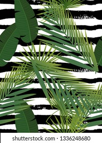 Beautiful tropical abstract color and green palm leaves seamless vector pattern on a background of geometric diagonal black and white lines