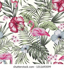 Beautiful tropical bird pink flamingo with flowers hibiscus, plumeria (frangipani) and palm, banana leaves composition. Vector seamless pattern on the white background