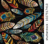 Beautiful tropical peacock feathers embroidery, template textiles, t-shirt design. Color feathers embroidery seamless pattern
