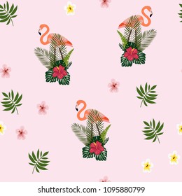Beautiful tropical seamless pattern with flamingos and flowers. Summer background with flamingos and tropical plants. Birds of the jungle.