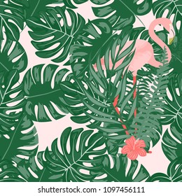 Beautiful tropical seamless pattern with flamingos and flowers. Summer background with flamingos and tropical plants. Birds of the jungle