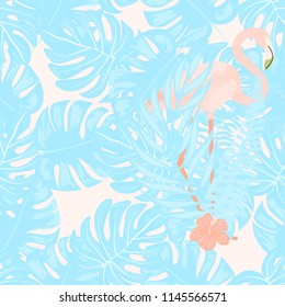 Beautiful tropical seamless pattern with flamingos and flowers. Summer background with flamingos and tropical plants. Birds of the jungle.