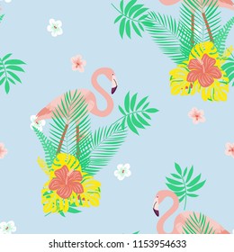 Beautiful tropical seamless pattern with flamingos and flowers. Summer background with flamingos and tropical plants. Birds of the jungle.