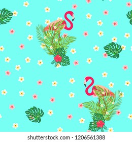 Beautiful tropical seamless pattern with flamingos and flowers. Summer background with flamingos and tropical plants. Birds of the jungle.