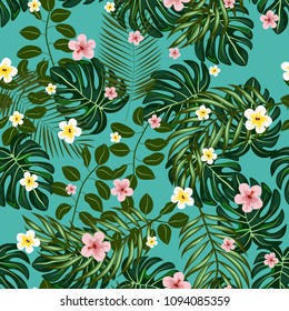 Beautiful tropical seamless pattern with flowers and leaves. Flowers of the jungle. Summer background with tropical leaves and flowers for fabric, wallpaper and cover.