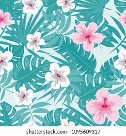 Beautiful tropical seamless pattern with flowers and leaves. Flowers of the jungle. Summer background with tropical leaves and flowers for fabric, wallpaper and cover.