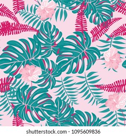 Beautiful tropical seamless pattern with flowers and leaves. Flowers of the jungle. Summer background with tropical leaves and flowers for fabric, wallpaper and cover.