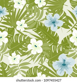 Beautiful tropical seamless pattern with flowers and leaves. Flowers of the jungle. Summer background with tropical leaves and flowers for fabric, wallpaper and cover