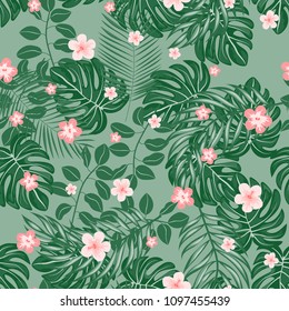 Beautiful tropical seamless pattern with flowers and leaves. Flowers of the jungle. Summer background with tropical leaves and flowers for fabric, wallpaper and cover