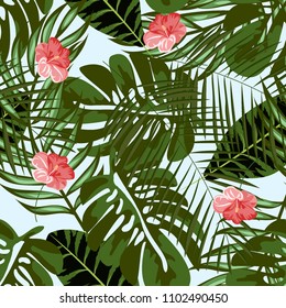 Beautiful tropical seamless pattern with flowers and leaves. Flowers of the jungle. Summer background with tropical leaves and flowers for fabric, wallpaper and cover