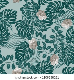 Beautiful tropical seamless pattern with flowers and leaves. Flowers of the jungle. Summer background with tropical leaves and flowers for fabric, wallpaper and cover.