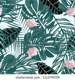 Beautiful tropical seamless pattern with flowers and leaves. Flowers of the jungle. Summer background with tropical leaves and flowers for fabric, wallpaper and cover.