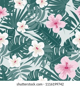 Beautiful tropical seamless pattern with flowers and leaves. Flowers of the jungle. Summer background with tropical leaves and flowers for fabric, wallpaper and cover.