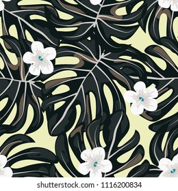Beautiful tropical seamless pattern with flowers and leaves. Flowers of the jungle. Summer background with tropical leaves and flowers for fabric, wallpaper and cover.