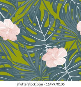 Beautiful tropical seamless pattern with flowers and leaves. Flowers of the jungle. Summer background with tropical leaves and flowers for fabric, wallpaper and cover