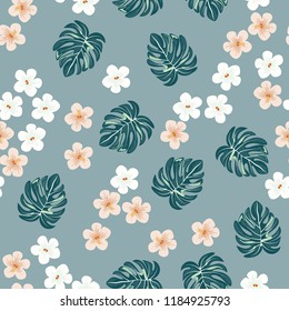 Beautiful tropical seamless pattern with flowers and leaves. Flowers of the jungle. Summer background with tropical leaves and flowers for fabric, wallpaper and cover