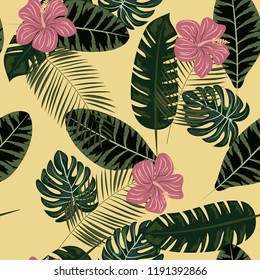 Beautiful tropical seamless pattern with flowers and leaves. Flowers of the jungle. Summer background with tropical leaves and flowers for fabric, wallpaper and cover