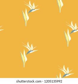 Beautiful tropical seamless pattern with flowers strelitzia. Summer background with tropical flowers on a blue background.