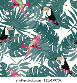 Beautiful tropical seamless pattern with parrot, toucan and leaves. Fashionable background with a parrot. Jungle. Tropical birds.