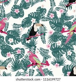 Beautiful tropical seamless pattern with parrot, toucan and leaves. Fashionable background with a parrot. Jungle. Tropical birds.