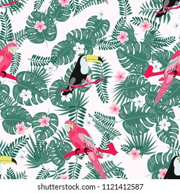 Beautiful tropical seamless pattern with parrot, toucan and leaves. Fashionable background with a parrot. Jungle. Tropical birds.