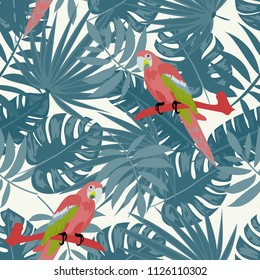 Beautiful tropical seamless pattern with parrot and leaves. Fashionable background with a parrot and flowers. Jungle. Tropical birds.