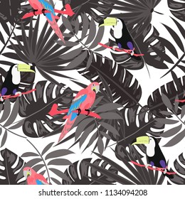 Beautiful tropical seamless pattern with parrot, toucan and leaves. Fashionable background with a parrot. Jungle. Tropical birds.