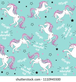 beautiful unicorn with lettering magic is all around us seamless pattern on a blue background