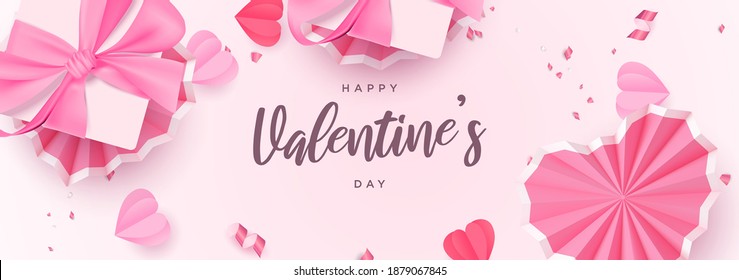 Beautiful valentine's day realistic flat lay banner with pink decorative hearts and gift box vector background