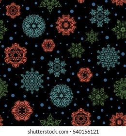 Beautiful vector green, blue and orange snowflakes isolated on a black background. Snowflakes, snowfall. Falling Christmas stylized snowflakes. Illustration.