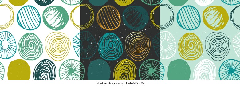 Beautiful vector set of three seamless grunge patterns in blue and green colors. Endless texture with abstract hand drawn round shapes. Repeating wallpapers. Trendy background design.