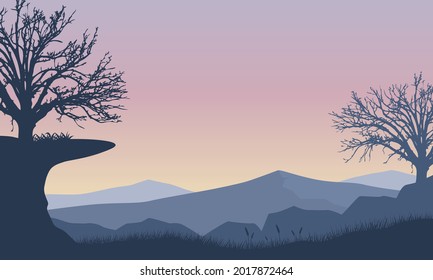 The beautiful view of the mountains from the out of town at sunrise with an aesthetically pleasing dry tree silhouette. Vector illustration of a city