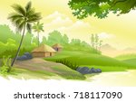 A beautiful village next to a pound, boulders, trees and meadows