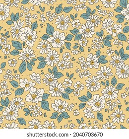 Beautiful vintage floral pattern in small realistic flowers. Small white flowers. Pale yellow background. Liberty style print. Floral seamless background. The elegant the template for fashion prints.