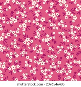 Beautiful vintage floral pattern. Small white flowers and burgundy leaves . pink background. Floral seamless background. An elegant template for fashionable prints.