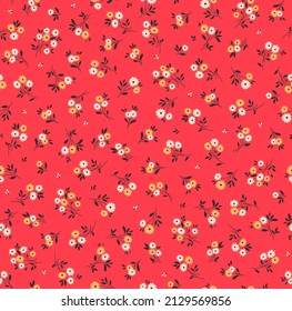 Beautiful vintage floral pattern in small flowers. Small yellow flowers. Red background. Liberty style print. Floral seamless background. The elegant the template for fashion prints.