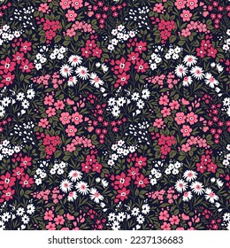 Beautiful vintage floral pattern in small flowers. Small pink flowers. Dark blue background. Liberty style print. Floral seamless background. Trendy template for fashion prints.