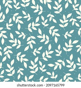 Beautiful vintage floral pattern. White leaves of the plant and dots. Blue background. Floral seamless background. An elegant template for fashionable prints.