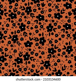 Beautiful vintage pattern. Black flowers and leaves . Terracotta background. Floral seamless background. An elegant template for fashionable prints.