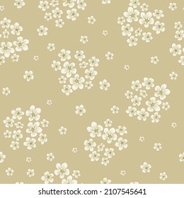 Beautiful vintage pattern. Small white flowers. Weighing bouquets. Beige background. Floral seamless background. An elegant template for fashionable prints.