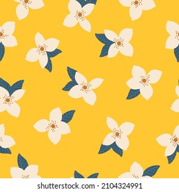 Beautiful vintage pattern. White flowers and blue leaves . Yellow background. Floral seamless background. An elegant template for fashionable prints.