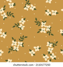 Hermoso patrón vintage. Flores y puntos blancos, hojas verdes. Fondo mostaza. Fondo floral sin fisuras. Una plantilla elegante para impresiones de moda.