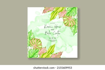 Beautiful wedding invitation with tropical leaves background
