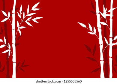 Beautiful white and burgundy bamboo on a red background. Asian background.